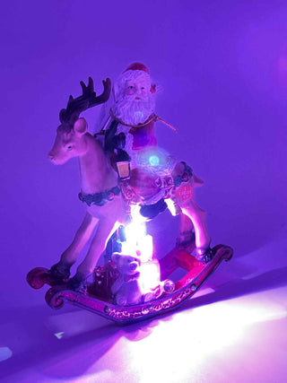 Resin Santa Clause on Toy Deer Figurine TC05454
