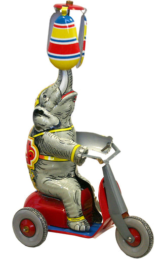 Tin wind-up circus elephant rides on scooter RM257