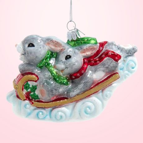 Noble Gems™ Glass Bunnies On Sled Ornament